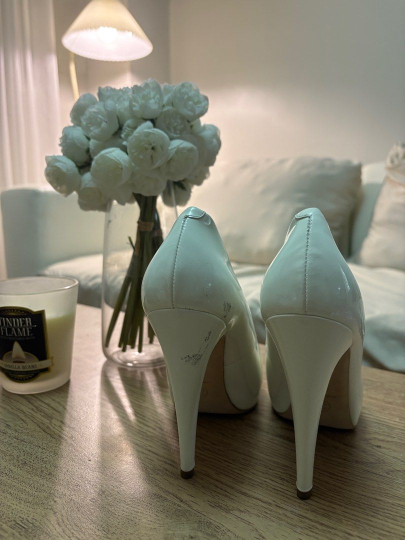 Authentic Chanel Patent Cap Toe CC Pumps (Category: Sneakers & Footwear) located in Quezon City. Submitted by wolfkeith (Listing ID 1398100108, Image 3). Description: Authentic Chanel Pumps w/ Certification - White with black cap toe Bought from Fashionphile US It’s a reputable secondhand shop with branches in multiple states. Important! - Size says 38.5 but designer shoes like Chanel has small sizing so this actually fits more like 36.5-37 Inclu