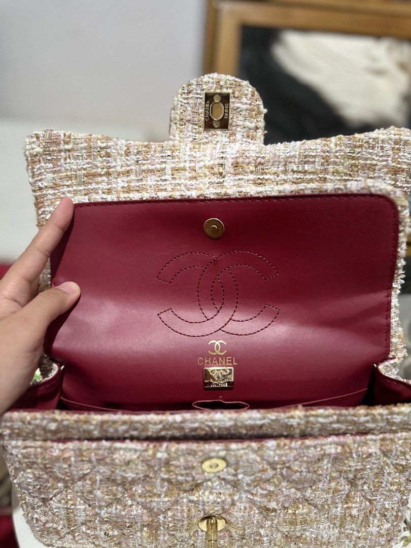 Chanel Tweed Flap Bag (Category: Luxury Bags & Wallets) located in Manila. Submitted by lenore1213 (Listing ID 1398103505, Image 2). Description: - Chanel Flap Bag - Tweed exterior with quilted pattern - Chain strap with white leather accents - Burgundy interior with Chanel logo - Gold-tone clasp closure.
