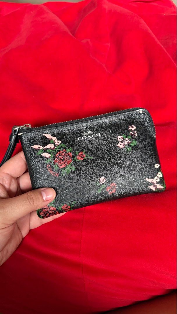 Coach Floral Print Wristlet (Category: Wallets & Card holders) located in Manila. Submitted by shetrim (Listing ID 1398017269, Image 3). Description: 🔜Barely used. 🔜Kindly no lowball offers — priced fairly based on condition. - Authentic Coach wristlet - Black exterior with floral print - Zip closure - Wrist strap included - Lined interior - Compact size - Coach logo detail.