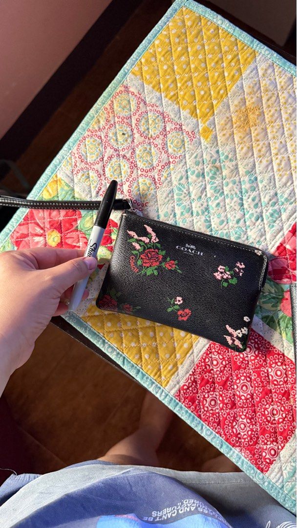Coach Floral Print Wristlet (Category: Wallets & Card holders) located in Manila. Submitted by shetrim (Listing ID 1398017269, Image 2). Description: 🔜Barely used. 🔜Kindly no lowball offers — priced fairly based on condition. - Authentic Coach wristlet - Black exterior with floral print - Zip closure - Wrist strap included - Lined interior - Compact size - Coach logo detail.