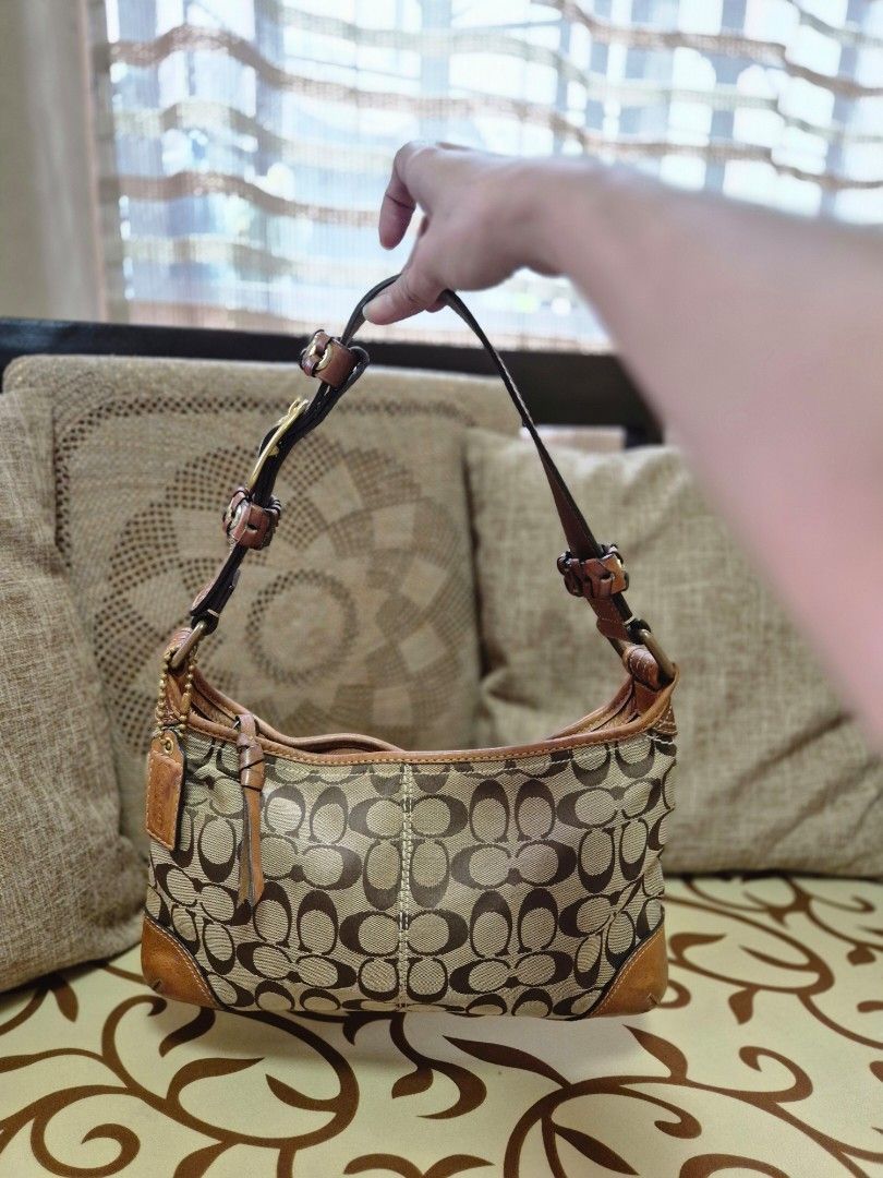 Coach kili bag (Category: Luxury Bags & Wallets) located in Quezon City. Submitted by jermiahh (Listing ID 1398005496, Image 1). Description: - Coach signature shoulder bag - Brown leather accents - Classic Coach pattern - Neutral color scheme - Adjustable shoulder strap - Includes leather tag.