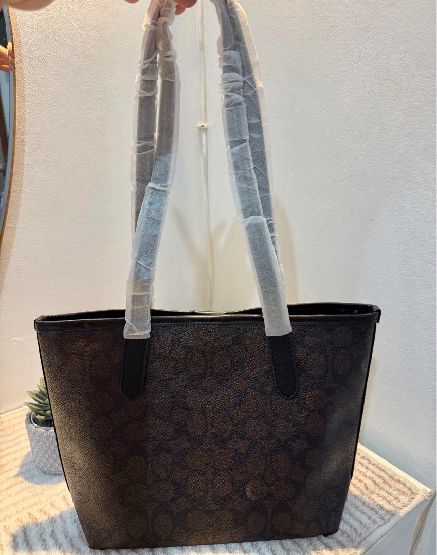 Coach Small city tote (Long handle) ‼️ (Category: Luxury Bags & Wallets) located in Las Pinas. Submitted by yhn_boutique (Listing ID 1398015616, Image 2). Description: Actual pic posted Complete inclusions Lalamove, grab.. Sameday J&T pay today ship today FB PAGE: Yhn Fashion Boutique .