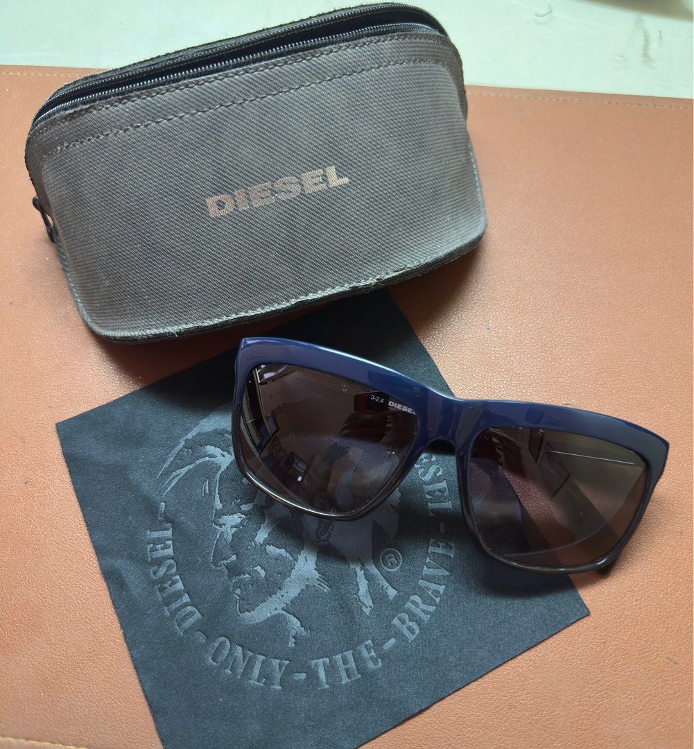 Diesel Navy Blue Sunglasses (Category: Sunglasses & Eyewear) located in Las Pinas. Submitted by essentialsbyj (Listing ID 1398058347, Image 1). Description: Diesel DL 0129-D Col.92W 100% Authentic Unisex Complete comes with case and cloth Frame in dark blue Navy Blue Gradient Brand new never worn/used No issue, scratches, dent RFS: Decluttering 📍Las Pinas area (df shouldered by buyer) .