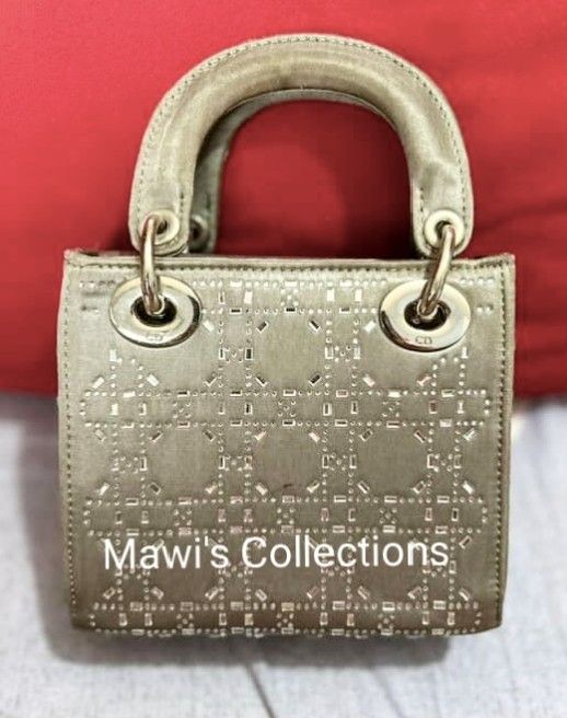 Lady Dior Limited Edition Grey Satin Bag (Category: Luxury Bags & Wallets) located in Cavite. Submitted by maisonmave.ph (Listing ID 1398013474, Image 2). Description: Dior Lady Dior Limited Edition Grey Satin Bag Grey satin with crystal Cannage embellishment. Details: - Size: W17 × D7.5 × H14 cm - Good condition with minor flaws: - Flap interior: Slight scratches - Body/handles/interior: Slight stains - Hardware: Slight scratches - Missing zippe