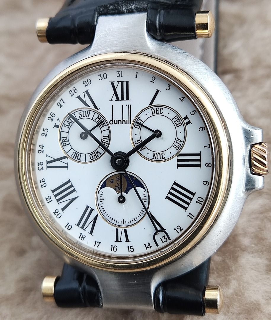 Dunhill Millenium TRIPLE-DATE MOONPHASE Gold-SS 32mm Mid Sized Watch SOLD AS IS (Category: Luxury Watches) located in Manila. Submitted by reloj (Listing ID 1398062940, Image 2). Description: DUNHILL MILLENIUM TRIPLE Calendar "Day - Date - Month" & MOONPHASE QUARTZ White ROMAN NUMERAL Dial GOLD PLATED & Stainless Steel Case & Leather Strap QUARTZ MOVEMENT with DAY, DATE, MONTH & MOONPHASE 32mm MID/BOY SIZED Watch WATCH RUNS BUT STOPS INTERMITTENT