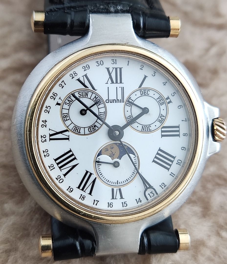 Dunhill Millenium TRIPLE-DATE MOONPHASE Gold-SS 32mm Mid Sized Watch SOLD AS IS (Category: Luxury Watches) located in Manila. Submitted by reloj (Listing ID 1398062940, Image 1). Description: DUNHILL MILLENIUM TRIPLE Calendar "Day - Date - Month" & MOONPHASE QUARTZ White ROMAN NUMERAL Dial GOLD PLATED & Stainless Steel Case & Leather Strap QUARTZ MOVEMENT with DAY, DATE, MONTH & MOONPHASE 32mm MID/BOY SIZED Watch WATCH RUNS BUT STOPS INTERMITTENT