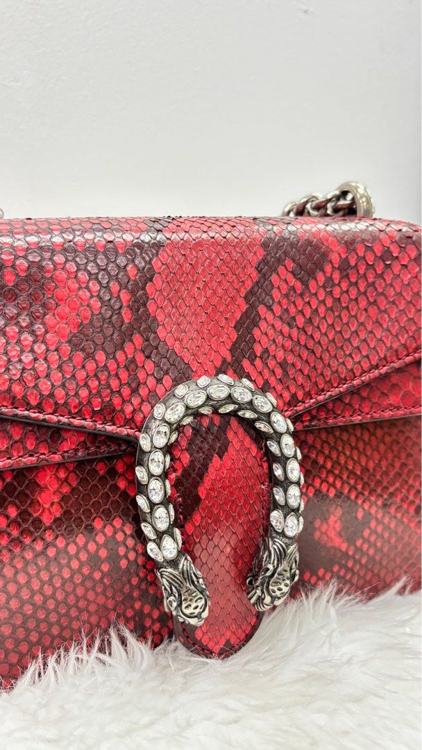 Gucci Dionysus Red Python Shoulder Bag (Category: Luxury Bags & Wallets) located in Taguig. Submitted by shoppersluxe2394 (Listing ID 1397990875, Image 2). Description: - Authentic Gucci Dionysus shoulder bag - Eye-catching red python exterior - Silver chain strap - Crystal-embellished tiger head closure - Structured shape - Flap closure - A statement accessory.