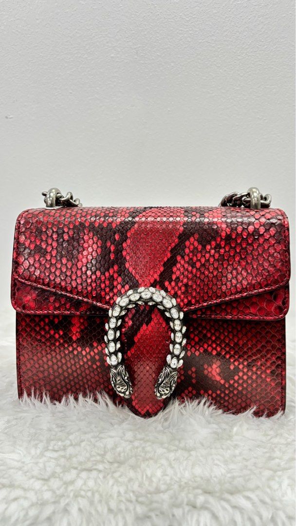 Gucci Dionysus Red Python Shoulder Bag (Category: Luxury Bags & Wallets) located in Taguig. Submitted by shoppersluxe2394 (Listing ID 1397990875, Image 1). Description: - Authentic Gucci Dionysus shoulder bag - Eye-catching red python exterior - Silver chain strap - Crystal-embellished tiger head closure - Structured shape - Flap closure - A statement accessory.