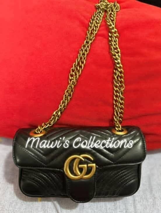 Gucci Mini Marmont Shoulder Bag (Category: Luxury Bags & Wallets) located in Cavite. Submitted by theprelovedbagstudio (Listing ID 1398019130, Image 1). Description: Gucci Mini Marmont Shoulder Bag Sleek black calf leather with gold-tone hardware. Key features: - Signature Marmont quilting - Double G logo foldover top - Chain-link strap - Heart-shaped stitching - Debossed logo and QR tag - Suede lining Composition: 100% Calf Leather Payment Terms