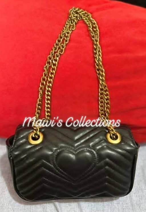 Gucci Mini Marmont Shoulder Bag (Category: Luxury Bags & Wallets) located in Cavite. Submitted by theprelovedbagstudio (Listing ID 1398019130, Image 3). Description: Gucci Mini Marmont Shoulder Bag Sleek black calf leather with gold-tone hardware. Key features: - Signature Marmont quilting - Double G logo foldover top - Chain-link strap - Heart-shaped stitching - Debossed logo and QR tag - Suede lining Composition: 100% Calf Leather Payment Terms