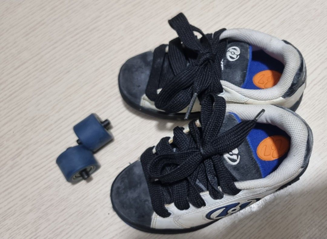Heelys 7224C Roller Shoes (Category: Sneakers) located in Marikina City. Submitted by andreah_16 (Listing ID 1398079248, Image 3). Description: - Heelys Roller Shoes - Style 7224C - Color: White, Black, and Blue - Size: US 12, UK 11, EUR 31, CM 18 - Includes: Two wheels and stoppers - Features: Laces and Heelys logo - Made in Indonesia.