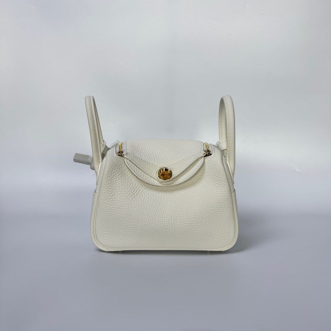 HERMES MINI LINDY CLEMENCE WHITE (Category: Luxury Bags & Wallets) located in Manila. Submitted by cjv.luxury (Listing ID 1398022316, Image 2). Description: CJV- 01069 Inclusions: DR.RUNWAY, DUSTBAG & BOX All items are available for 3 months layaway For cash buyers, items are negotiable. Just shoot your offer Trades are welcome, you can bring other luxury bags/items that you wish to sell and we can convert it to store credit. 100 We are an Entrup