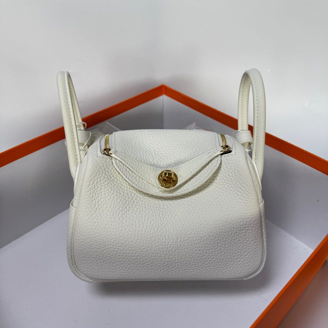 HERMES MINI LINDY CLEMENCE WHITE (Category: Luxury Bags & Wallets) located in Manila. Submitted by cjv.luxury (Listing ID 1398022316, Image 1). Description: CJV- 01069 Inclusions: DR.RUNWAY, DUSTBAG & BOX All items are available for 3 months layaway For cash buyers, items are negotiable. Just shoot your offer Trades are welcome, you can bring other luxury bags/items that you wish to sell and we can convert it to store credit. 100 We are an Entrup