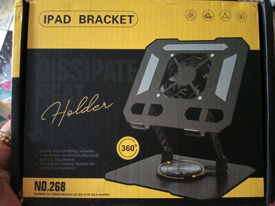 iPad Bracket or Holder (Category: Other Accessories) located in Daraga. Submitted by declutter.with_me (Listing ID 1398026152, Image 1). Description: REPRICED FROM 999 - iPad Bracket/Holder - Features a built-in fan - Designed for tablets from 4-18 inches - 360-degree rotating chassis.