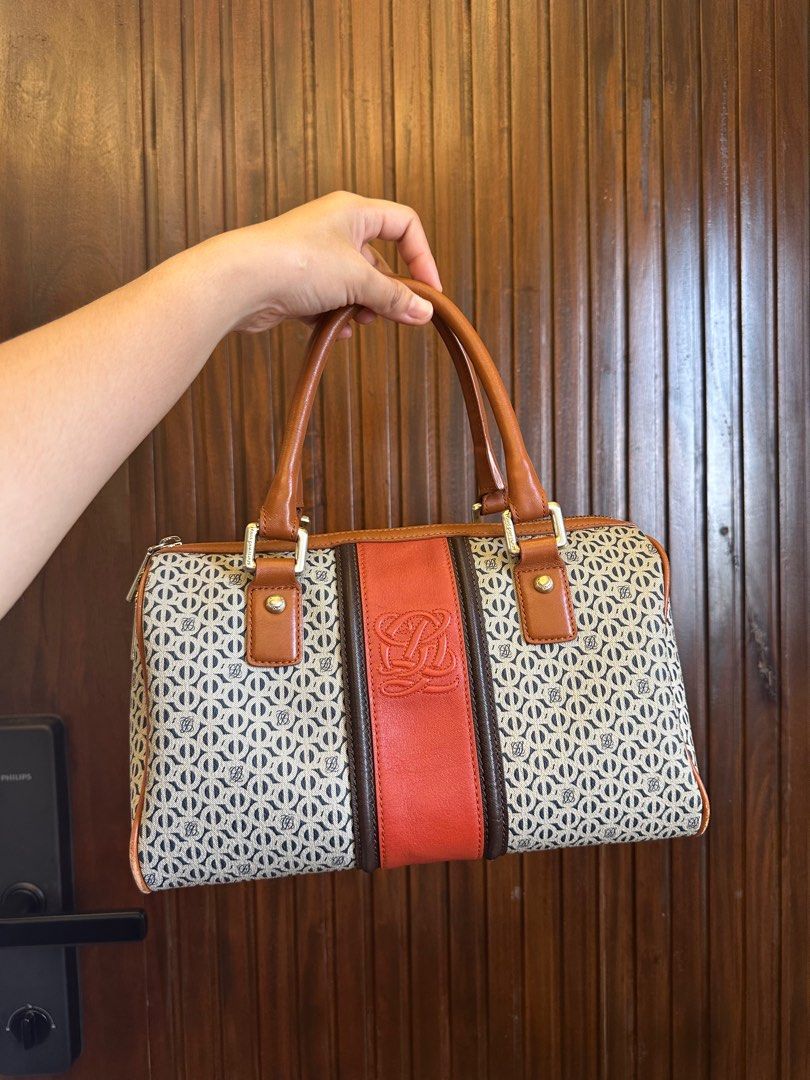 Louis Quatorze (Category: Luxury Bags & Wallets) located in Dagupan City. Submitted by thymeph (Listing ID 1398018300, Image 2). Description: - Unique patterned handbag - very durable - comes with authenticity cards - Eye-catching orange stripe detail - Brown leather handles and accents - Secure zipper closure - Features a logo on the front - Stylish and fashionable design.