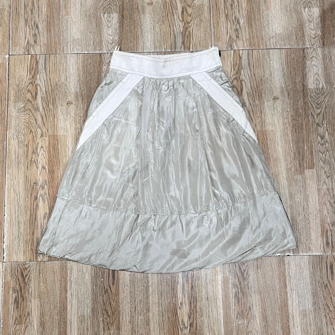 Louis Vuitton Beige Skirt (Category: Luxury Apparel) located in Bacolod City. Submitted by boujee.wardrobes (Listing ID 1398155235, Image 1). Description: - Authentic Vintage Louis Vuitton skirt from Marc Jacobs era - Beige color with white waistband and accents - Features LV logo zipper - Made in France, size 38 - Pleated design with subtle sheen size 38 on tag waist: 25-27 adjustable length: 24.5.