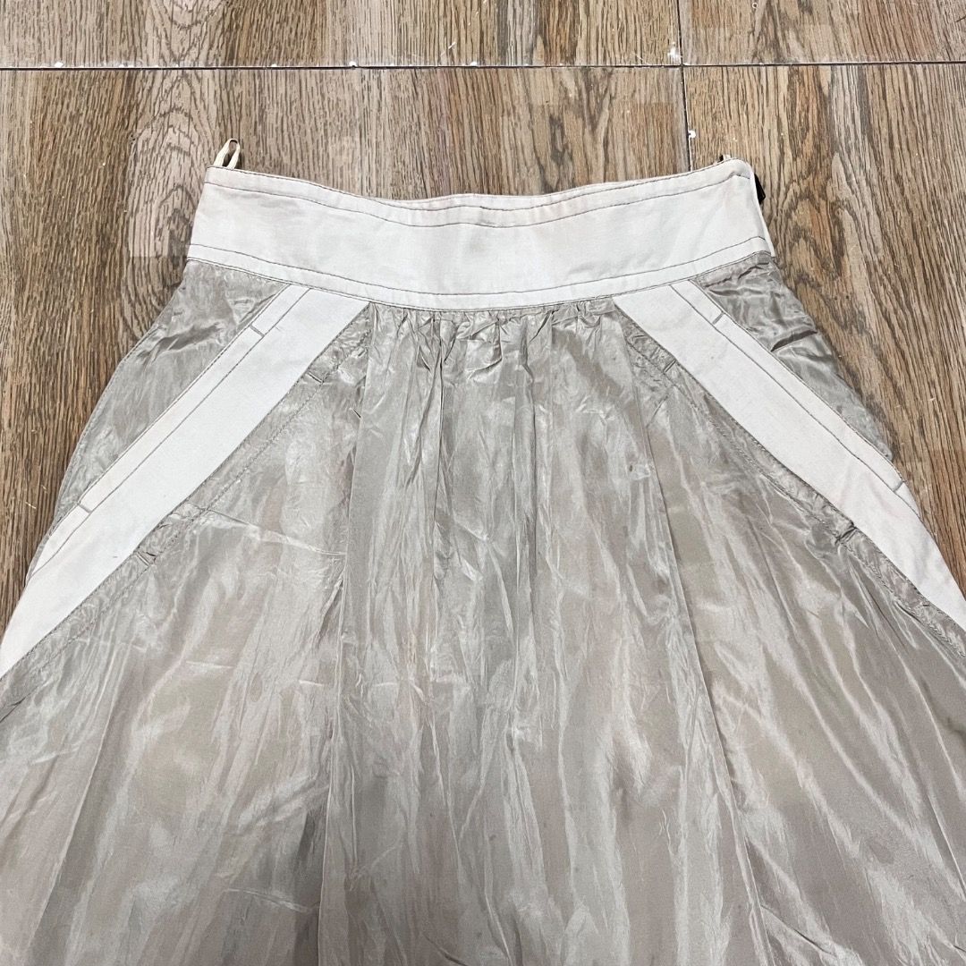 Louis Vuitton Beige Skirt (Category: Luxury Apparel) located in Bacolod City. Submitted by boujee.wardrobes (Listing ID 1398155235, Image 2). Description: - Authentic Vintage Louis Vuitton skirt from Marc Jacobs era - Beige color with white waistband and accents - Features LV logo zipper - Made in France, size 38 - Pleated design with subtle sheen size 38 on tag waist: 25-27 adjustable length: 24.5.