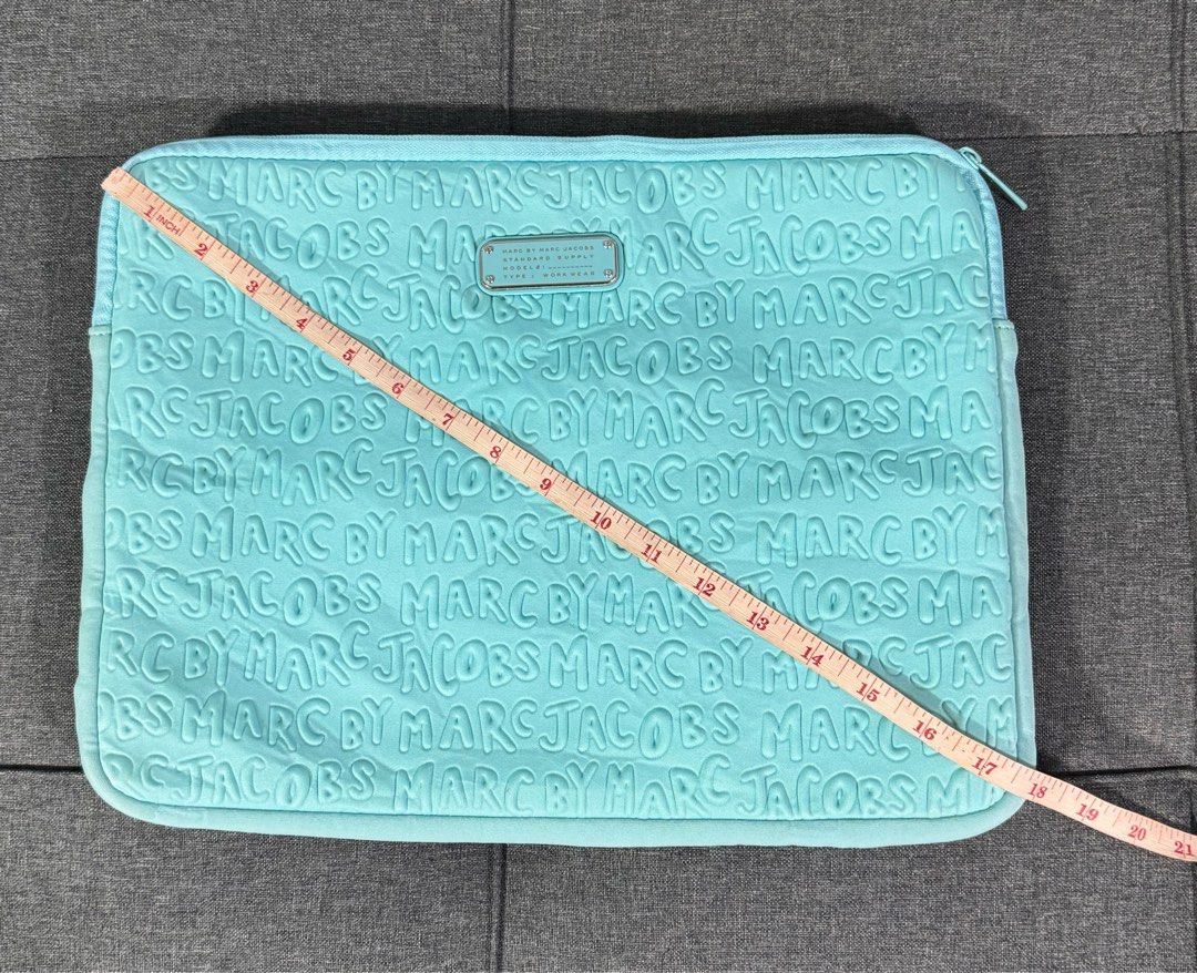 Marc Jacobs laptop case (001B) (Category: Laptop Bags & Sleeves) located in General Santos City (Dadiangas). Submitted by curatedstuffs101 (Listing ID 1398039758, Image 2). Description: Overall condition of the item is in great condition however there is a slight chipping on the zipper.pls refer to the last photo attached. Lighweight Neoprene in fabric Color: turquoise .