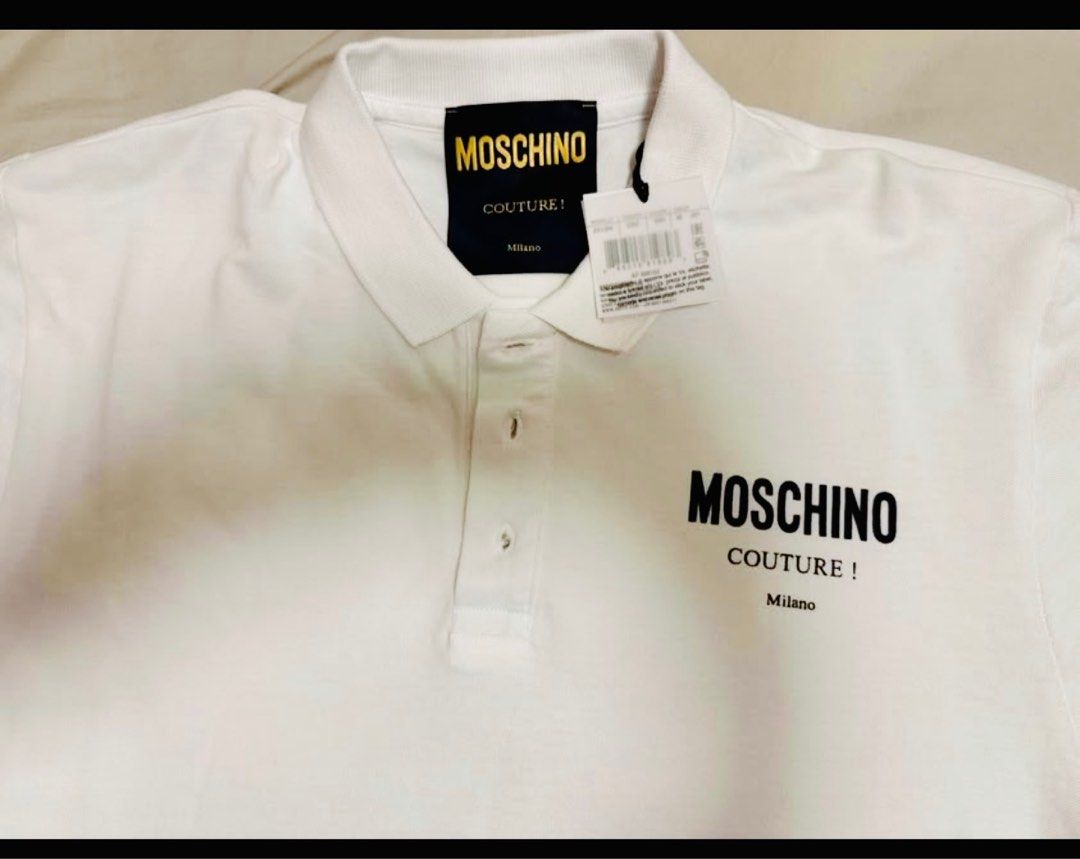 Moschino Couture Polo Shirt (Category: Tshirts & Polo Shirts ) located in Manila. Submitted by adanielbm (Listing ID 1398146682, Image 1). Description: - Moschino Couture polo shirt - White color - Features Moschino logo on the chest - Classic polo collar and button-up placket - Made in Italy Brand new with tag.