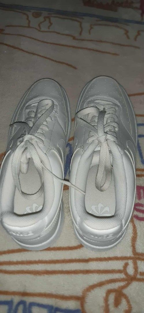 Nike Court Vision Low White Sneakers (Category: Sneakers) located in Plaridel. Submitted by luckyhat (Listing ID 1398024302, Image 3). Description: - Nike Court Vision Low sneakers - White color - Nike logo on heel and side - Lace-up closure - Perforated toe box - White soles.