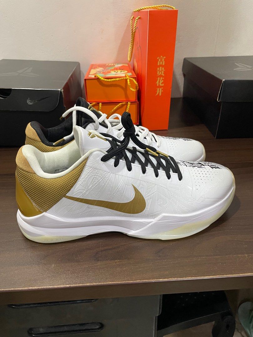 Nike Kobe V Protro 1/2 White Metallic Gold (Category: Sneakers) located in Quezon City. Submitted by moonz_13 (Listing ID 1397979341, Image 2). Description: Brand New - Never been used. This is a personal collection but needs to let it go. RFS: Need Funds .