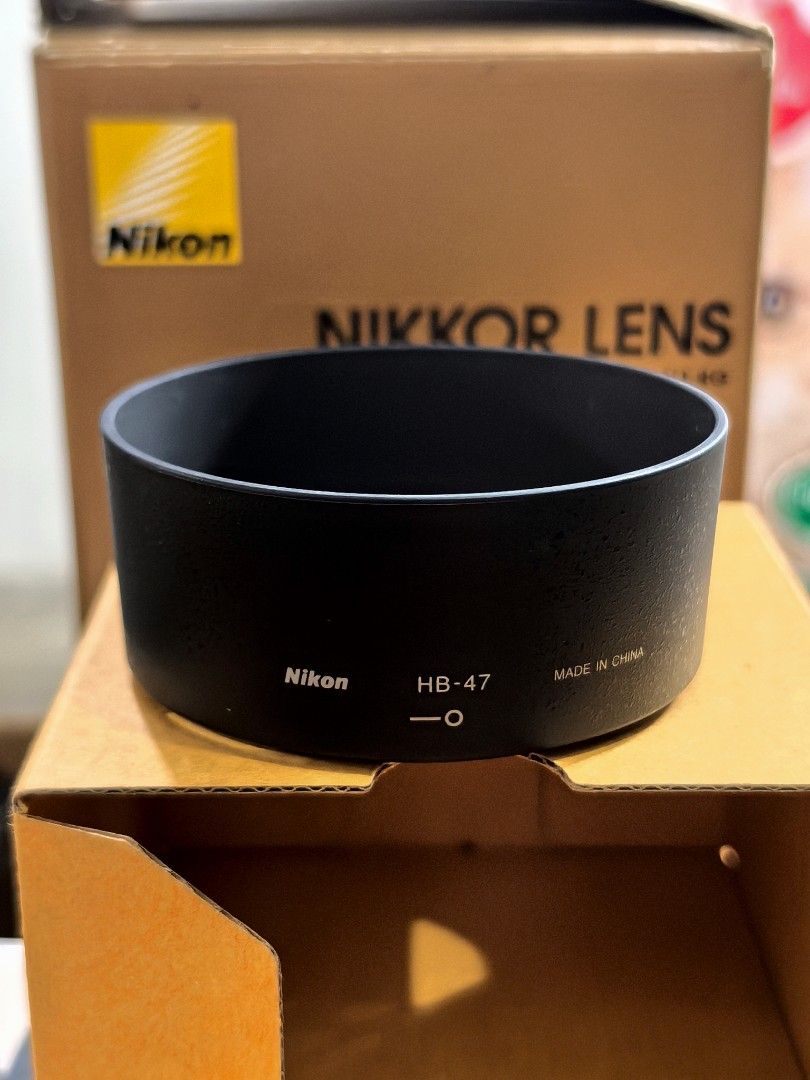 Nikon HB-47 Lens Hood (Category: Cameras) located in Quezon City. Submitted by studiojpeg (Listing ID 1398028200, Image 2). Description: Never been used. Kept in the box - Genuine Nikon HB-47 lens hood - Designed for Nikon lenses - Color: Black - Made in China - Reduces lens glare - Protects against scratches and impacts - Comes with box.