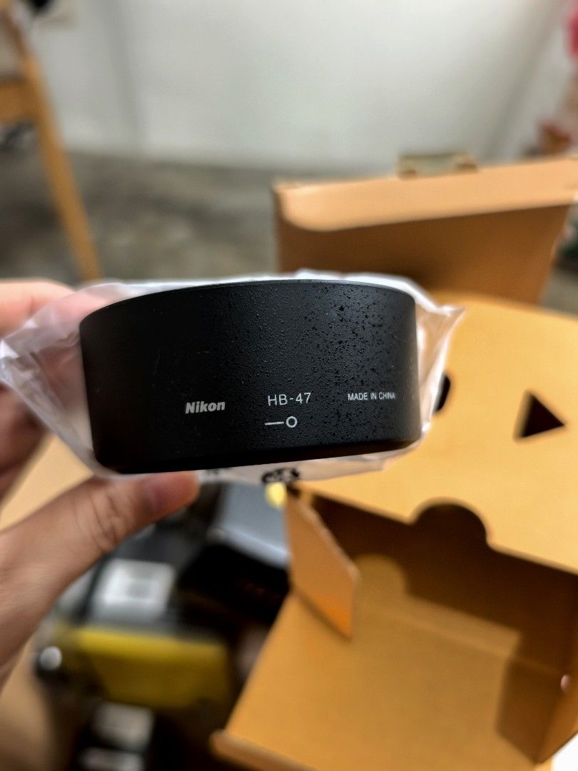 Nikon HB-47 Lens Hood (Category: Cameras) located in Quezon City. Submitted by studiojpeg (Listing ID 1398028200, Image 3). Description: Never been used. Kept in the box - Genuine Nikon HB-47 lens hood - Designed for Nikon lenses - Color: Black - Made in China - Reduces lens glare - Protects against scratches and impacts - Comes with box.
