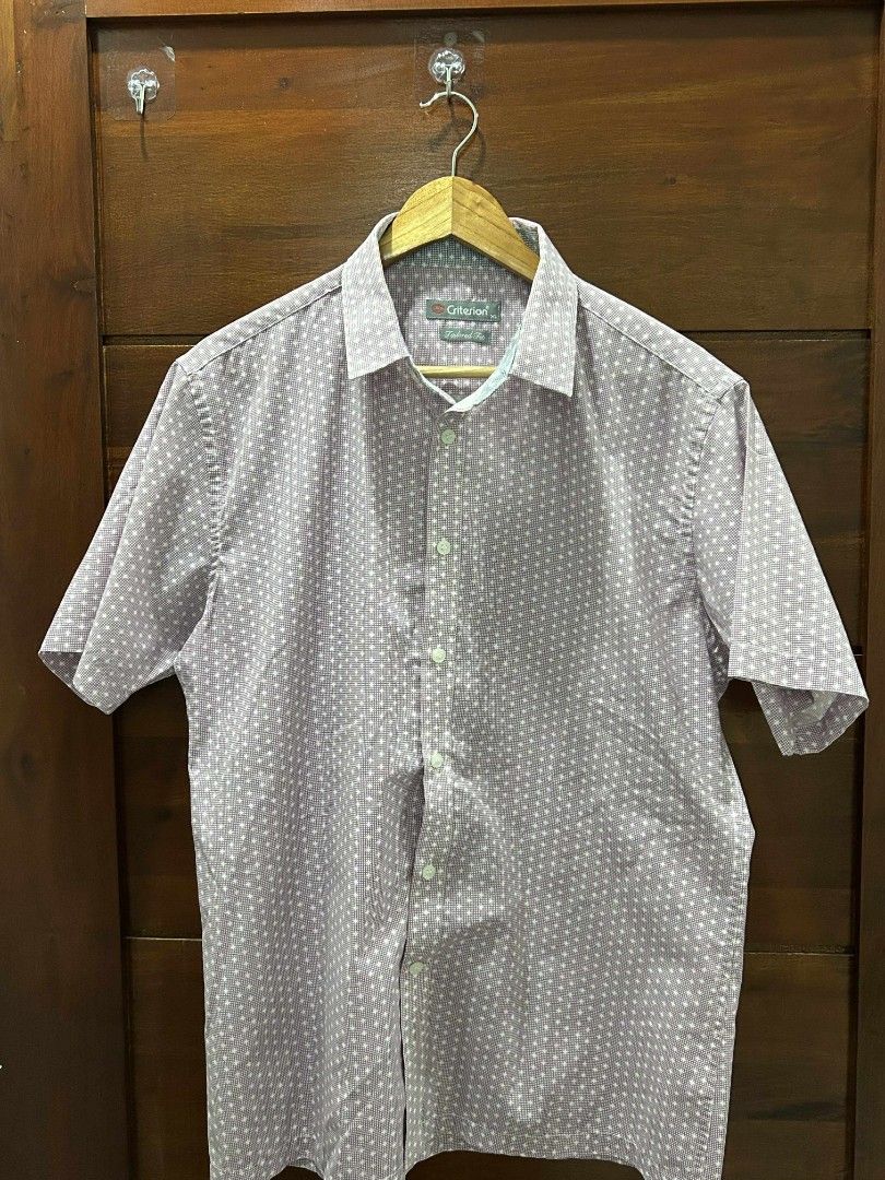 Original Penguin Short Sleeve Shirt (Category: Tshirts & Polo Shirts ) located in Mabalacat. Submitted by fn_thrifty.360 (Listing ID 1398116012, Image 1). Description: - Original Penguin shirt - Short sleeve - Light purple color - White polka dots - Button-down closure - Collared neckline - Brand label visible.