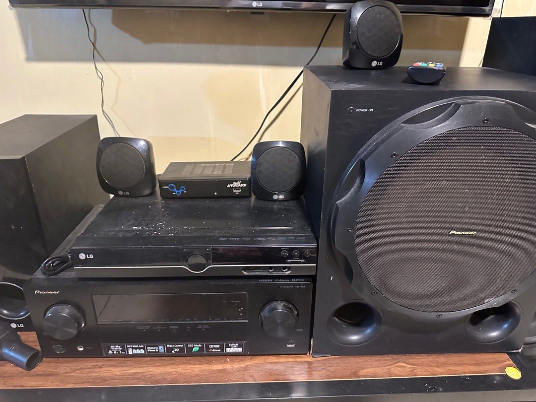 Pioneer Speaker Set with Subwoofer (Category: Soundbars, Speakers & Amplifiers) located in Mandaluyong City. Submitted by grace.dt (Listing ID 1398026176, Image 2). Description: - Complete Pioneer speaker set - Includes tower speakers, subwoofer, and satellite speakers - Features a receiver and DVD player - All necessary components for a home entertainment system - Black color - Includes remote control.