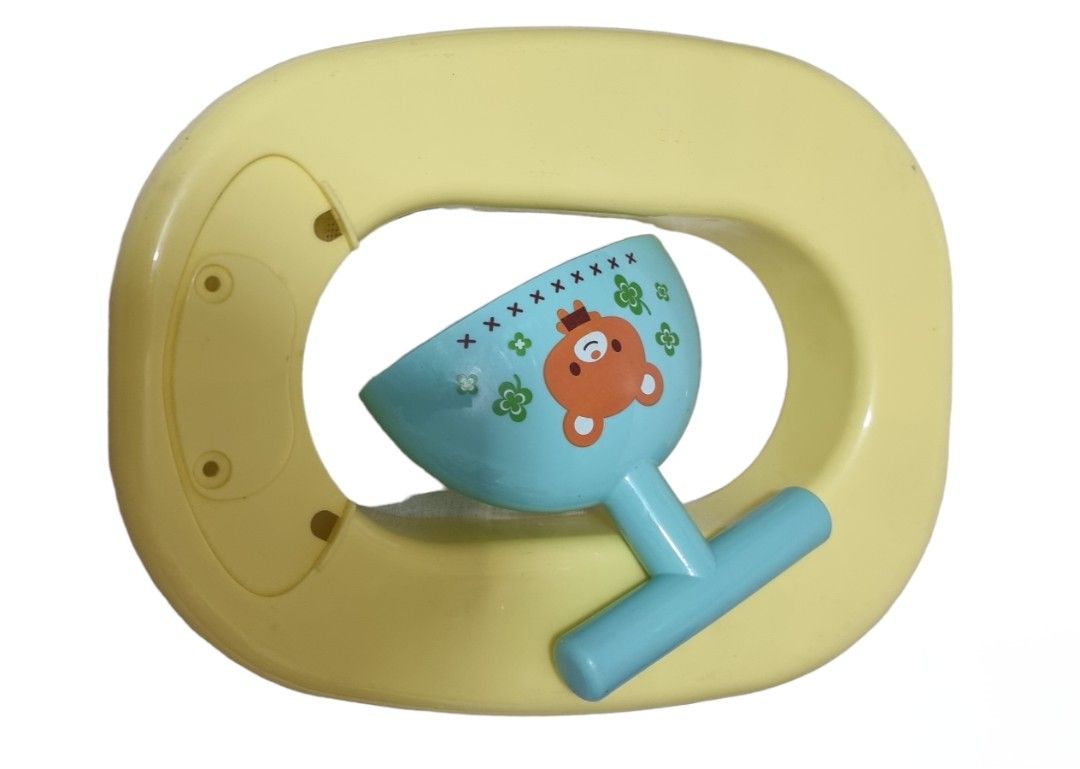 Potty trainer put in a bowl (Category: Weaning & Toddler Feeding) located in Marikina City. Submitted by andreah_16 (Listing ID 1398001300, Image 2). Description: - Adorable potty trainer. - Features a cute yellow and blue design. - Designed to help with potty training. - Easy to clean..
