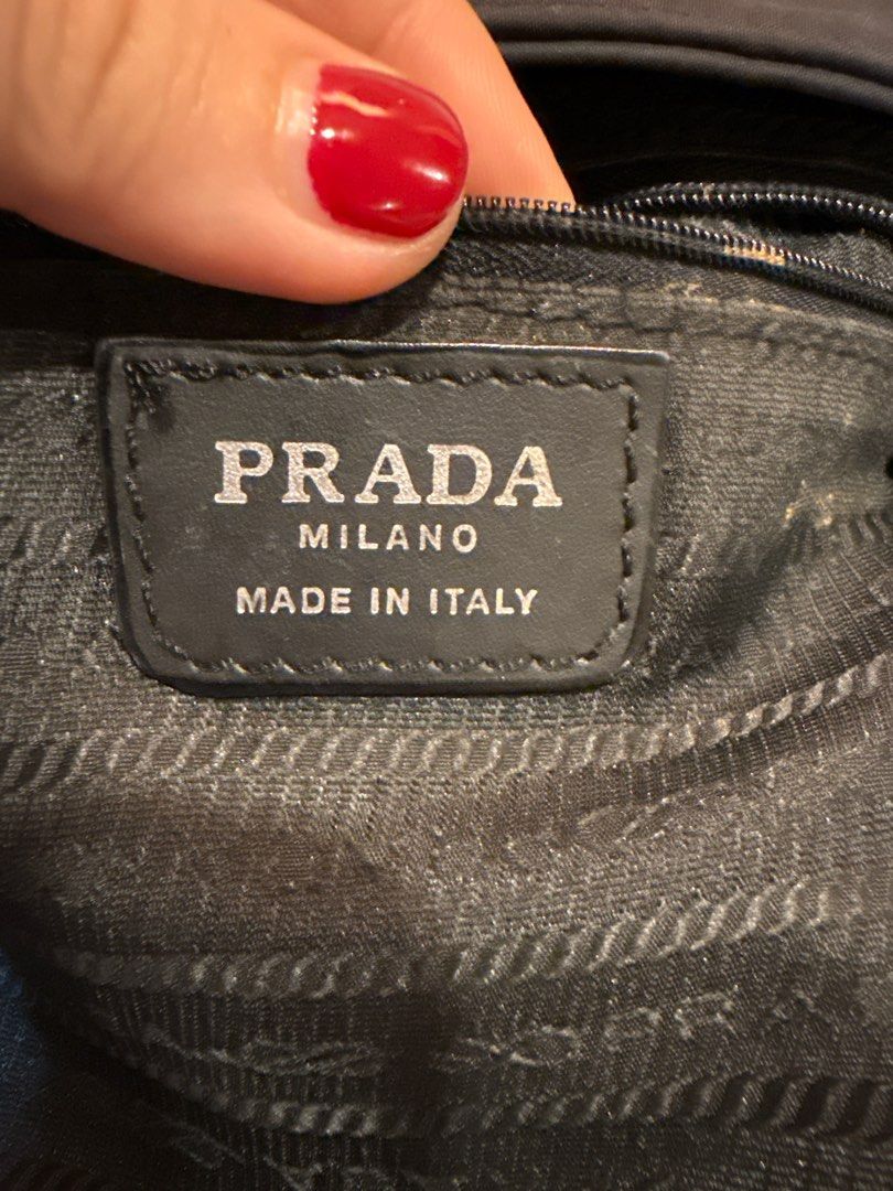 Prada Black Chain Bag (Category: Luxury Bags & Wallets) located in Manila. Submitted by rottweiler_lover (Listing ID 1398088542, Image 3). Description: - Authentic Prada handbag - Color: Black - Features chain strap - Prada logo on front and hardware - Two interior compartments with zipper closures - Made in Italy - Interior lining shows some wear needs to be washed with soap .