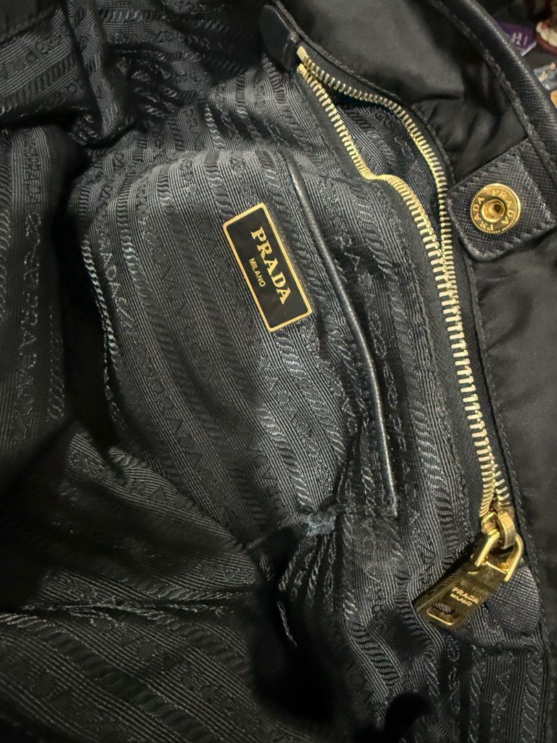Prada BR4997 Nylon Shoulder Tote Bag with Leather Drawstring- Black (Category: Luxury Bags & Wallets) located in Paranaque City. Submitted by sillybella (Listing ID 1398022779, Image 3). Description: Lower Shipping fee check out c/o orange app Prada classic tote is crafted in durable & light-weight nylon & trimmed in saffiano leather. Ideal for the sophisticated lady who prefers an understated bag with effortless practicality. Fits A4-sized folde