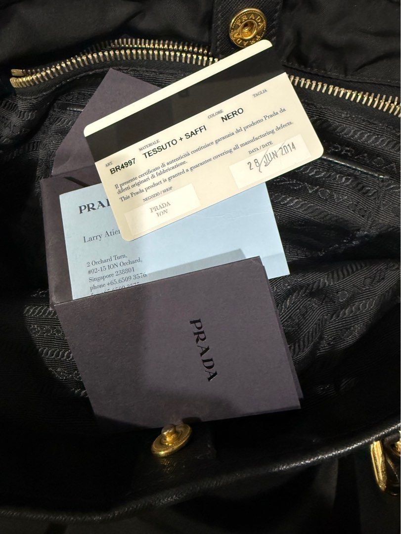 Prada BR4997 Nylon Shoulder Tote Bag with Leather Drawstring- Black (Category: Luxury Bags & Wallets) located in Paranaque City. Submitted by sillybella (Listing ID 1398022779, Image 2). Description: Lower Shipping fee check out c/o orange app Prada classic tote is crafted in durable & light-weight nylon & trimmed in saffiano leather. Ideal for the sophisticated lady who prefers an understated bag with effortless practicality. Fits A4-sized folde