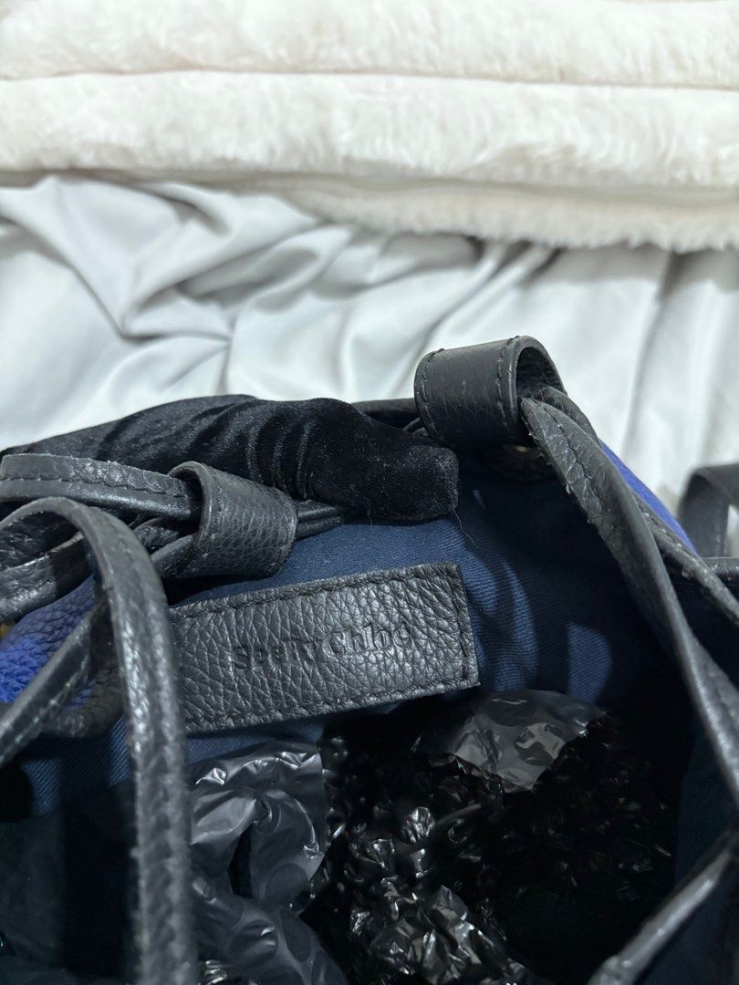 See by chloe Blue Leather Bucket Bag (Category: Luxury Bags & Wallets) located in Baguio. Submitted by luxe2600 (Listing ID 1398160233, Image 3). Description: - sea by chloe bucket bag - Blue leather exterior with black leather accents - Drawstring closure - Shoulder strap - Tassel details - Black interior - Brand name visible inside.