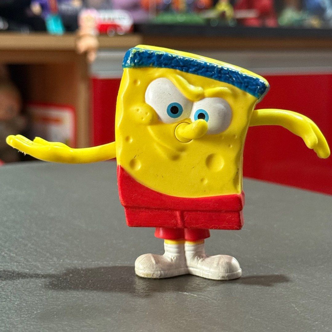 Spongebob Squarepants Happy Meal Figure (Category: Figurines & Statues) located in Manila. Submitted by whosewhoo (Listing ID 1398156332, Image 1). Description: - Spongebob Squarepants collectible figure. - Dressed in athletic gear: blue headband, red shorts, white shoes. - Dynamic pose with outstretched arm. - Ideal for Spongebob fans and collectors..