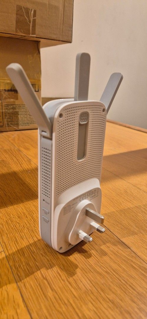 TP-Link wifi range extender AC1200 (Category: Networking) located in Taguig. Submitted by ipsagar (Listing ID 1398018033, Image 2). Description: - model: RE355 - Extends your existing wifi signal - well used but working great - some discoloration (see pic) - crack on left antenna but fixed (see pic) - UK plug price negotiable.