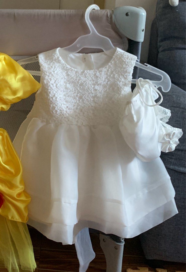 White Lace Baptismal Dress set (Category: Babies & Kids Fashion) located in Mandaluyong City. Submitted by cmeshop (Listing ID 1398036154, Image 1). Description: - White dress with lace bodice - Flowing, multi-layered skirt - Round neckline, sleeveless design - Includes matching headdress - Ideal for christening.