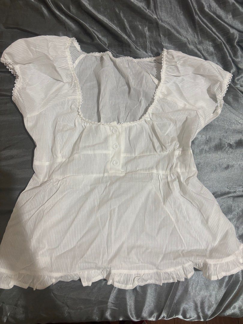 white short sleeved summer blouse (Category: Blouses) located in Quezon City. Submitted by 003ryu (Listing ID 1398137170, Image 1). Description: size: M - brand new, still has packaging (the one i’m selling has never been opened) - note: this is see through so you need to wear inner - rfs: didn’t notice that i purchased 2 😅 - Original price: ₱289 MOP: gcash/bpi/bdo MOD: same day delivery only (lalamove/grab/etc) helping tags summer coquette cari