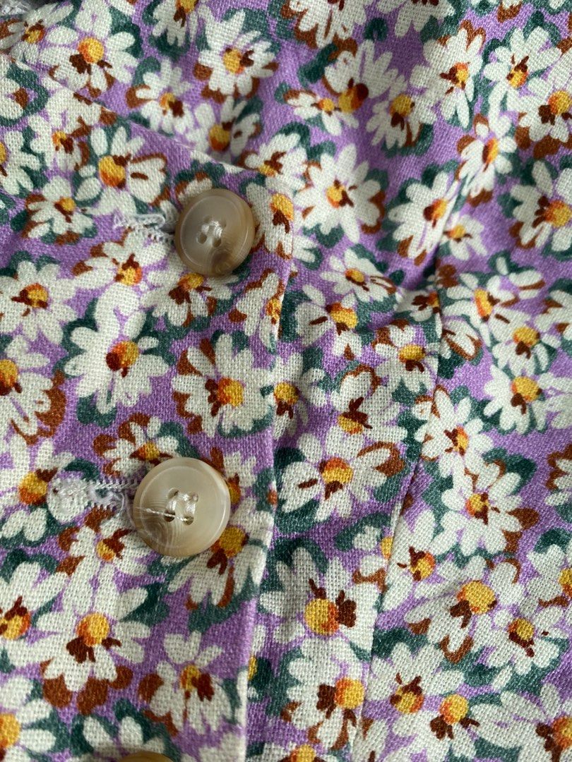 Zara Top (Category: Blouses) located in Cavite. Submitted by jaydaascollection (Listing ID 1398013486, Image 2). Description: Zara floral top with button details. Features a square neckline and thick straps. The top has a daisy print and is made in Morocco. Size S. The top is paired with black shorts in the first image..