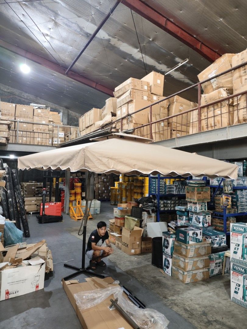2.5m x 2.5m Cantilever Umbrella (Category: Umbrellas) located in Manila. Submitted by grc14_furniture (Listing ID 1398260920, Image 1). Description: - 2.5m x 2.5m cantilever umbrella - Beige canopy with scalloped edge - Sturdy base and dark-colored frame - Designed for outdoor use - Provides sun protection - Easy to set up and use HAWAII - Multifunctional Square Umbrella ‼️ Affordable Coffee shop umbrella Beach Umbrella Garden Umbrella Outdoor um