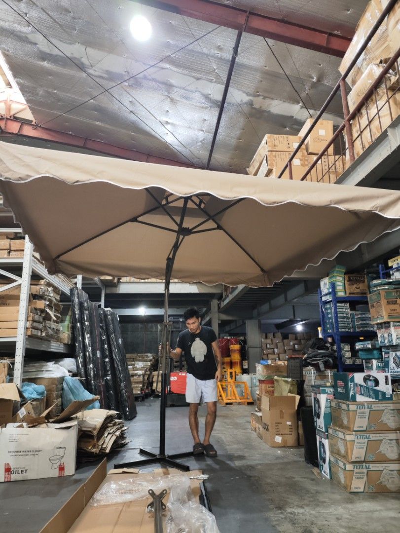 2.5m x 2.5m Cantilever Umbrella (Category: Umbrellas) located in Manila. Submitted by grc14_furniture (Listing ID 1398260920, Image 2). Description: - 2.5m x 2.5m cantilever umbrella - Beige canopy with scalloped edge - Sturdy base and dark-colored frame - Designed for outdoor use - Provides sun protection - Easy to set up and use HAWAII - Multifunctional Square Umbrella ‼️ Affordable Coffee shop umbrella Beach Umbrella Garden Umbrella Outdoor um