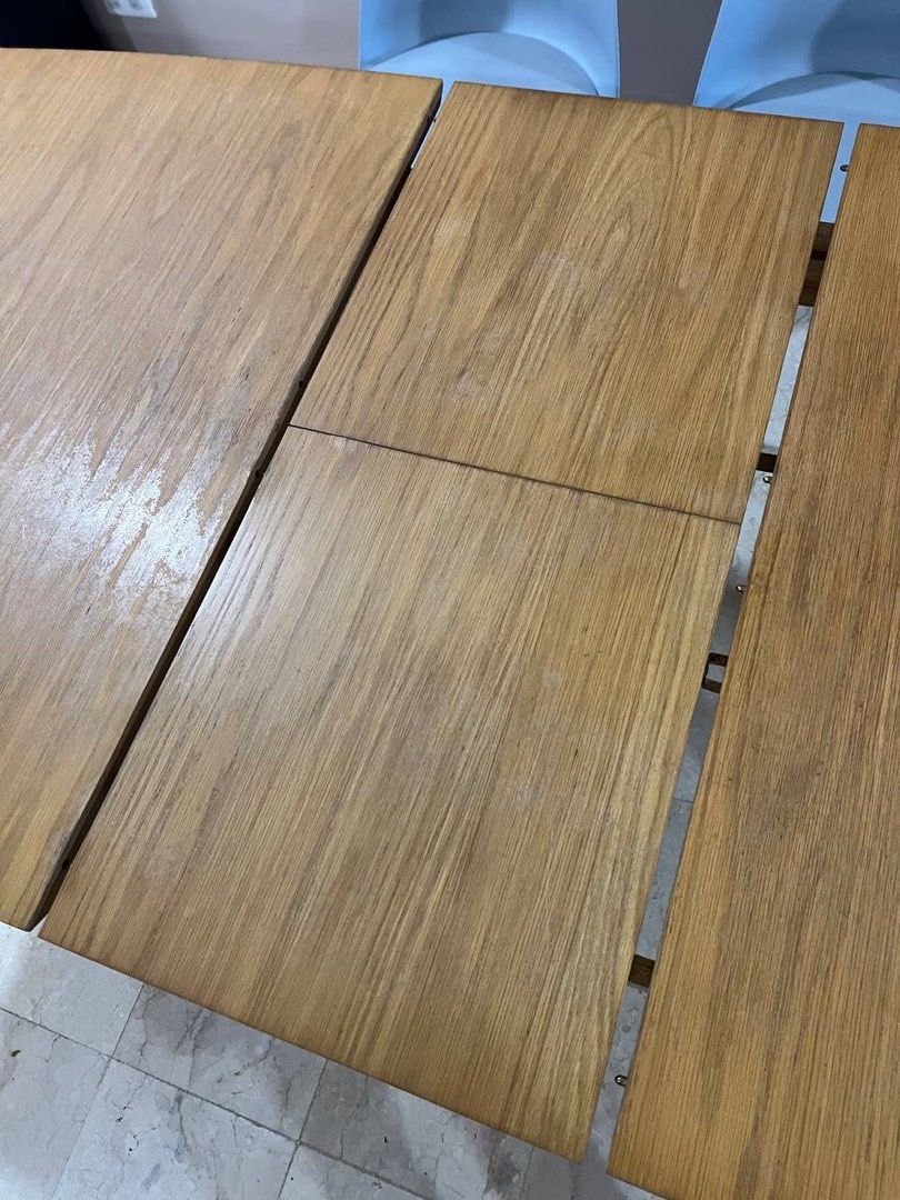 4-6 SEATER Expandable Dining Table in Oak (Category: Tables & Sets) located in Makati City. Submitted by theotherhand.mnl (Listing ID 1398236308, Image 3). Description: Expandable dining table 190cm W (fully expanded) x 90cm D x 76cm H With scratches and scuffs, and some areas with water damage (not flat).