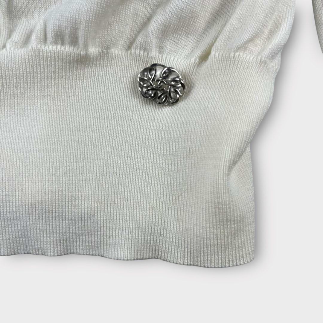 Chanel - Camelia Blooming Knit Wool Jumper Top (Category: Longsleeves) located in Los Banos. Submitted by declutterking (Listing ID 1398337366, Image 3). Description: Size 36 on tag Made of knitted wool. It has a silver hardware at the hem. Material: 100% virgin wool Dimensions: 13" shoulders 17.5" chest 21.75" length 23.5" sleeves 10.25" hem Brand new with tag Authentic .
