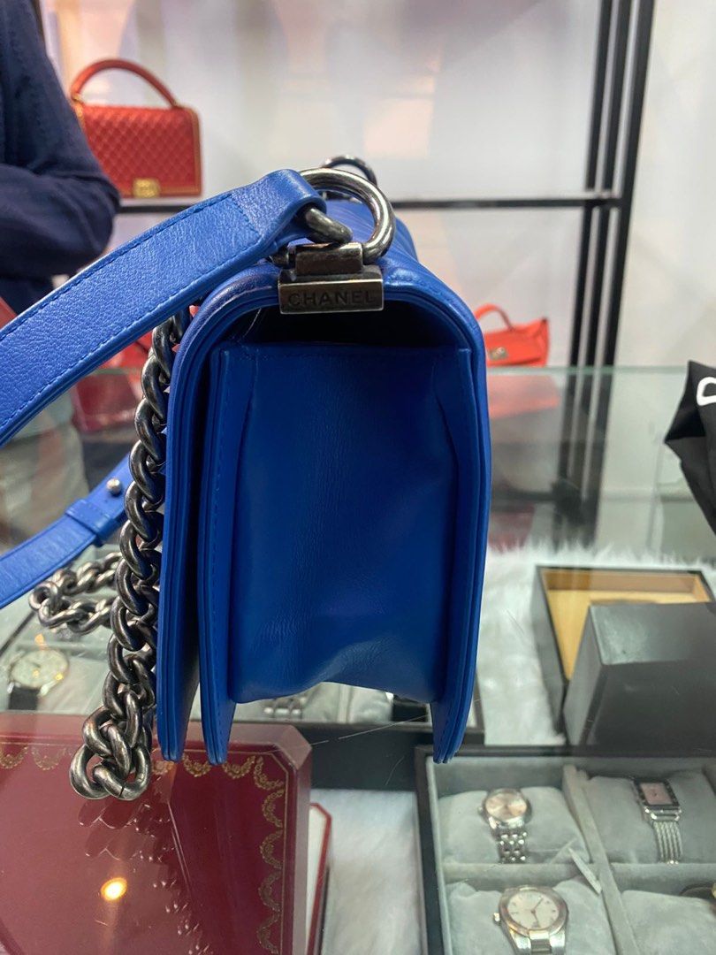 Chanel Boy Bag Blue (Category: Luxury Bags & Wallets) located in Rodriguez. Submitted by nancyb13 (Listing ID 1398246141, Image 3). Description: - Authentic Chanel Boy Bag - Vibrant blue color - Chevron quilted design - Silver-tone chain strap - Main compartment and small pocket - Includes dust bag - Comes with an additional strap - Classic rectangular shape -Negotiable for sure buyer - Push-lock closure.