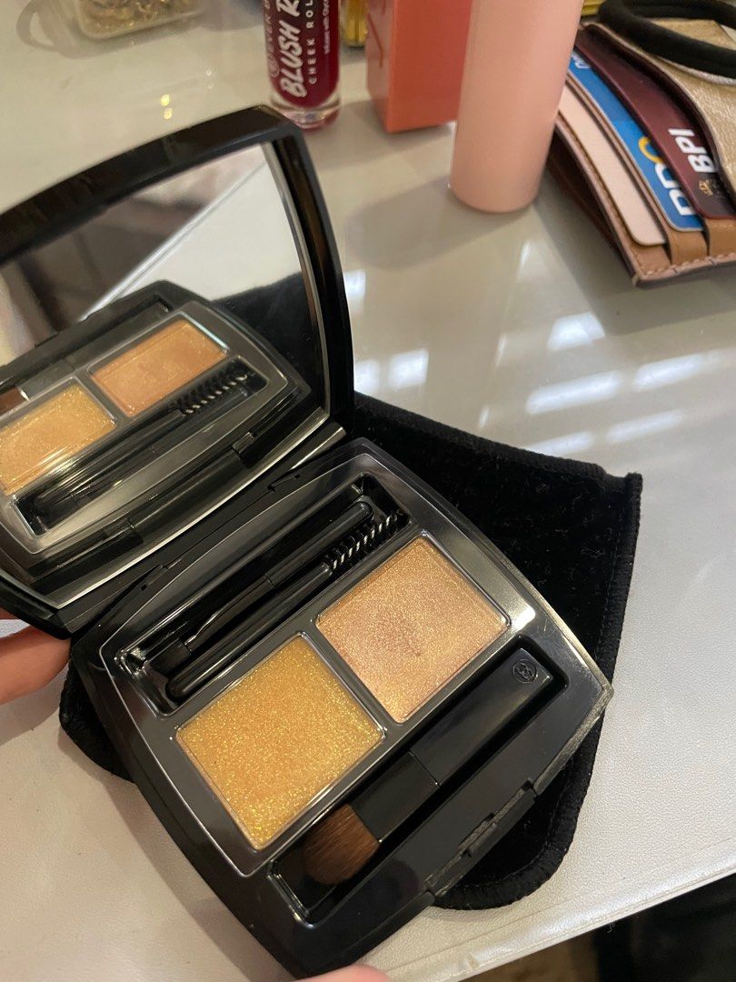 Chanel Eyeshadow Palette (Category: Makeup) located in Cavite. Submitted by riricakes (Listing ID 1398261731, Image 1). Description: Swatched only -not my shade - Chanel eyshadow palette - Includes two powder shades (gold and light brown) - Comes with a brush and spoolie - Presented in a black compact with a mirror Still negotiable.