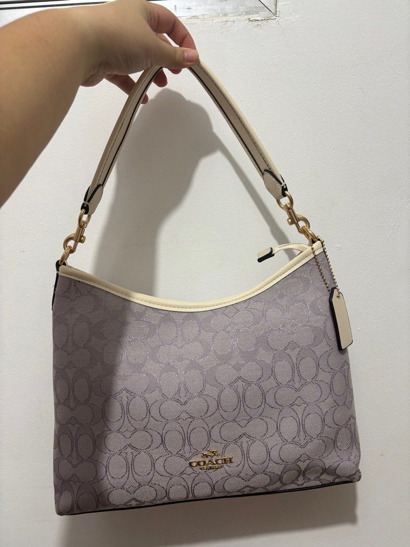 Coach Laurel (Category: Luxury Bags & Wallets) located in Manila. Submitted by prelovedbykylieeeec (Listing ID 1398305815, Image 2). Description: - Coach shoulder bag brandnew!! - Signature pattern - Cream-colored strap and trim - Gold-tone logo and hardware - Includes Coach hang tag.