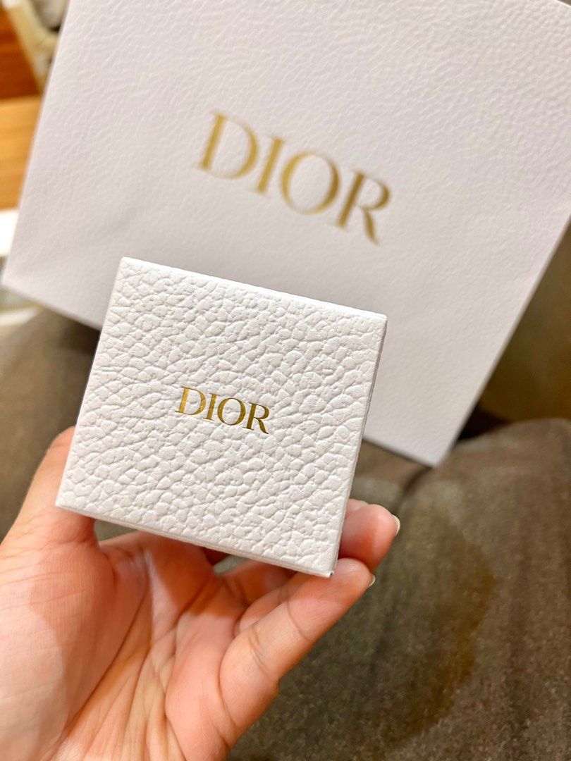 Dior Cube Puzzle (Category: Luxury Bags & Wallets) located in Makati City. Submitted by mesograyss (Listing ID 1398248065, Image 2). Description: - Dior cube puzzle - Features the iconic CD logo - Comes with a white box and Dior paper bag - White cube base with gold CD logos - Perfect for Dior fans and puzzle lovers GWP Paperbag included (perfect for gifting).