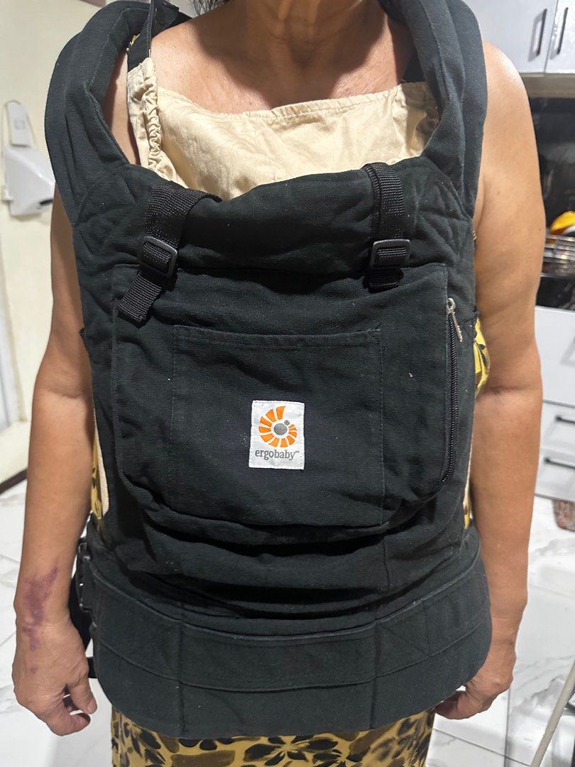 Ergobaby Baby Carrier (Category: Carriers & Slings) located in Manila. Submitted by yesh_ie (Listing ID 1398178999, Image 1). Description: - Ergobaby baby carrier - Black exterior, beige - Features a front pocket - Adjustable straps for a comfortable fit - Perfect for on-the-go parents - Safe and secure for your baby.