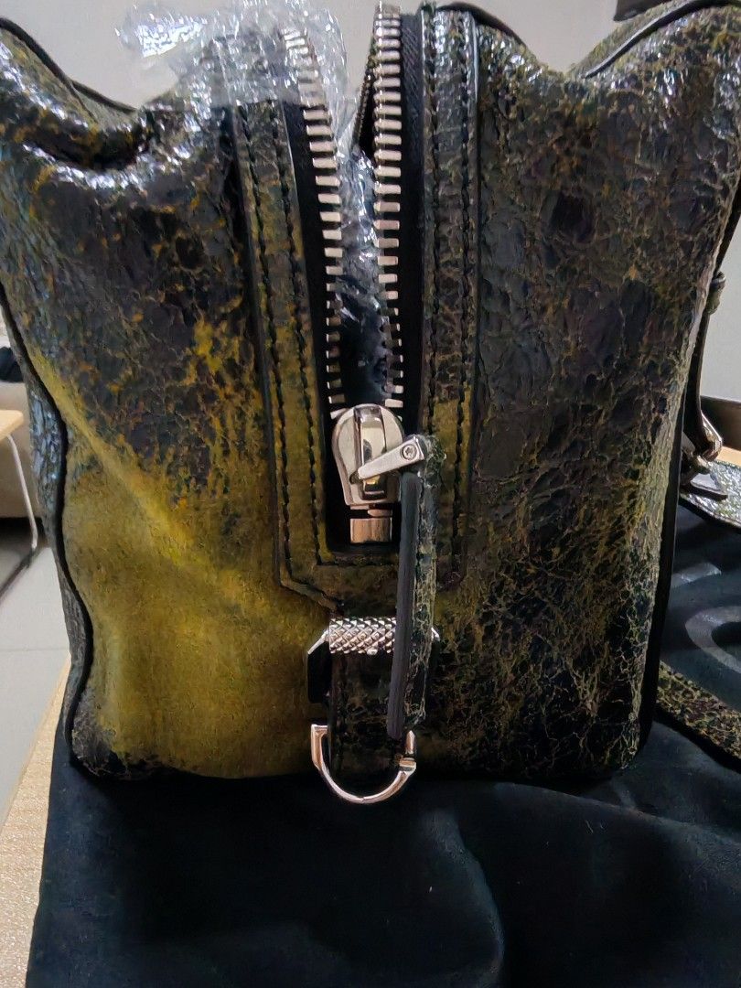 Givenchy Pandora (Category: Luxury Bags & Wallets) located in Bacoor. Submitted by jadeitemaster (Listing ID 1396886455, Image 3). Description: Cracked Leather 100% Authentic, Authenticated in Japan. Bought in Japan Cindition: Unused but not brand new. Almost Unused condition but stored in a luxury closet. No any scratches, damage, made of High Quality materials. Suitable for Givenchy collectors only. If you admire Givenchy, this is for you. With