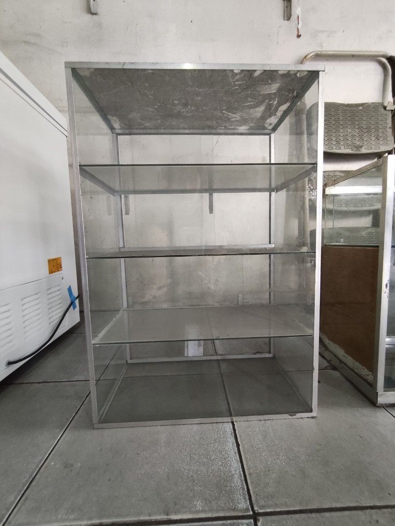 Glass Display Cabinet with Shelves (Category: Shelves, Cabinets & Racks) located in Quezon City. Submitted by buyensell15 (Listing ID 1398229757, Image 1). Description: FOR SALE - Glass display cabinet - Three shelves - Aluminum frame - Rectangular shape - Dimensions: 9" (D) 23.7 (H) 16(W) - Ideal for displaying items.